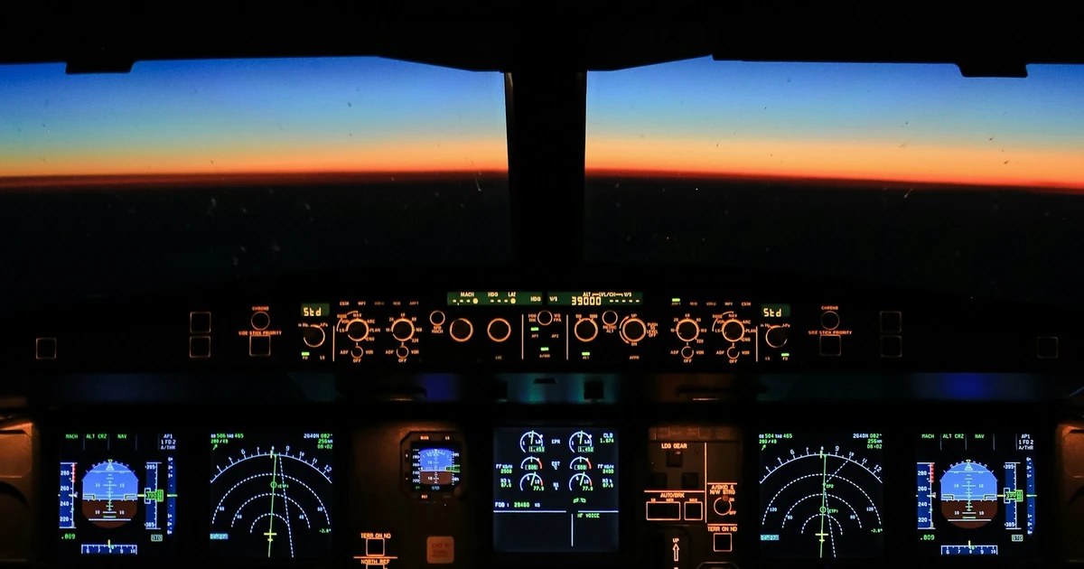 An airplane cockpit showing gauge and radar indicators